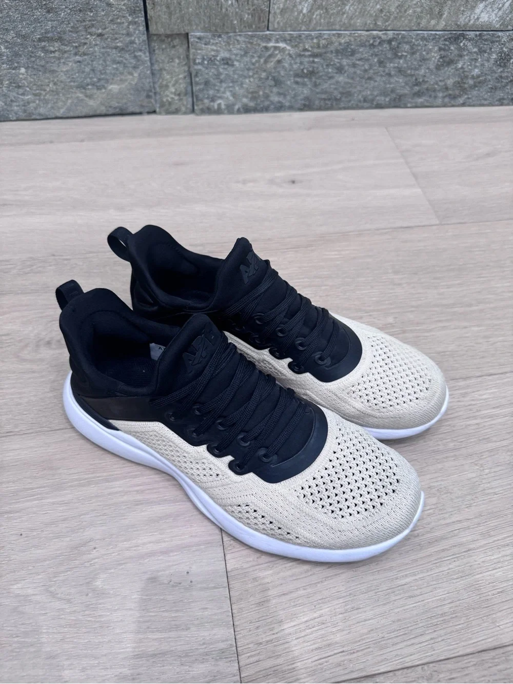APL Two-Tone Knit Sneakers in Black and Cream